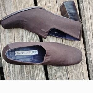 Elegant slip-on pumps by Donald J. Pliner. Rich dark brown color.